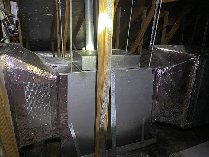 Air handlers and insulated ductwork installed in a Harlingen attic by the Texas HeatWave A/C and Heating team