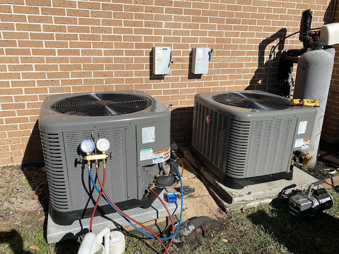 Two residential AC condensers being charged and tested during a Texas Heatwave service call