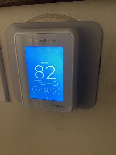 Honeywell smart thermostat installed on a home wall by Texas Heatwave for better comfort and air control
