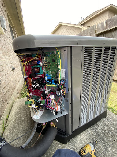 Texas Heatwave technician repairing an open air conditioning condenser during a same-day service call