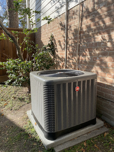 Rheem AC condenser unit serviced by Texas Heatwave AC and Heating at a Cypress, TX home