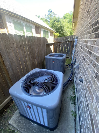 Dual Rheem AC condenser units installed by Texas Heatwave AC and Heating at a Katy, TX home